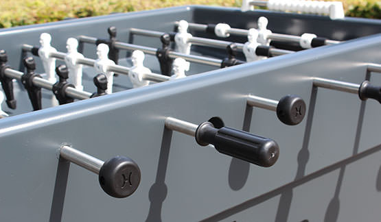 Ergonomic handles at the bars of the football table.